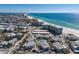 Expansive overhead image showing residential housing and condos bordering the white sand beaches at 5400 Gulf Dr # 25, Holmes Beach, FL 34217