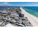 Scenic aerial view features white sandy beaches with a community of condos and private residences at 5400 Gulf Dr # 25, Holmes Beach, FL 34217