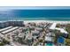Beautiful aerial view of a residential community with a pool, tennis court, and ocean access at 5400 Gulf Dr # 25, Holmes Beach, FL 34217