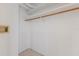 This closet offers simple storage solutions with a single shelf and rod for hanging clothes at 5400 Gulf Dr # 25, Holmes Beach, FL 34217