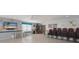 Clubhouse includes a television, book shelves and stacks of chairs at 5400 Gulf Dr # 25, Holmes Beach, FL 34217
