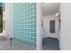 Condo entrance with turquoise block wall and steps to the front door at 5400 Gulf Dr # 25, Holmes Beach, FL 34217