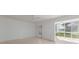 An empty living room with tile floors and a ceiling fan at 5400 Gulf Dr # 25, Holmes Beach, FL 34217