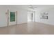 Bright living room with neutral tile flooring, lots of natural light, and a ceiling fan at 5400 Gulf Dr # 25, Holmes Beach, FL 34217