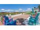 Comfortable outdoor patio area with colorful chairs and ocean view at 5400 Gulf Dr # 25, Holmes Beach, FL 34217