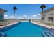 Inviting pool with steps and beautiful landscaping at 5400 Gulf Dr # 25, Holmes Beach, FL 34217