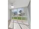 Sunroom with lots of natural light and a view of the exterior landscaping at 5400 Gulf Dr # 25, Holmes Beach, FL 34217