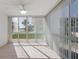 Sunroom with lots of natural light and a view of the exterior landscaping at 5400 Gulf Dr # 25, Holmes Beach, FL 34217