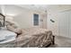 Bedroom featuring a queen bed with white comforter and decorations at 5527 Palmer Cir # 105, Bradenton, FL 34211