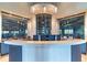 Modern clubhouse reception area with sleek counters and a stylish wine display at 5527 Palmer Cir # 105, Bradenton, FL 34211