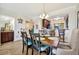 Dining area with wooden table and chairs near an open kitchen area at 5527 Palmer Cir # 105, Bradenton, FL 34211