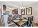 Dining area with wooden table and chairs next to the kitchen area at 5527 Palmer Cir # 105, Bradenton, FL 34211