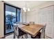 Dining area with a wooden table set and sliding glass door to the outside at 5527 Palmer Cir # 105, Bradenton, FL 34211