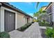 Exterior of the house and walkway with greenery around the house at 5527 Palmer Cir # 105, Bradenton, FL 34211