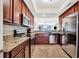 Well-equipped kitchen with stainless steel appliances and granite countertops at 5527 Palmer Cir # 105, Bradenton, FL 34211
