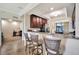 Open concept kitchen with counter seating, adjacent to dining area and workspace at 5527 Palmer Cir # 105, Bradenton, FL 34211