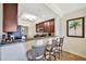 Modern kitchen featuring granite countertops, stainless steel appliances, and bar seating at 5527 Palmer Cir # 105, Bradenton, FL 34211