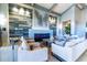 Comfortable lounge area featuring cozy seating arrangements and a modern fireplace focal point at 5527 Palmer Cir # 105, Bradenton, FL 34211