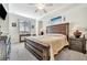 Spacious main bedroom with a large bed, wooden furniture, and neutral color scheme at 5527 Palmer Cir # 105, Bradenton, FL 34211