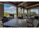 Covered outdoor seating area with tables and chairs, ideal for enjoying the fresh air and community views at 5527 Palmer Cir # 105, Bradenton, FL 34211
