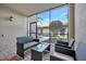 Cozy screened-in patio featuring wicker furniture and a pleasant view at 5527 Palmer Cir # 105, Bradenton, FL 34211