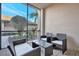 Cozy screened-in patio featuring wicker furniture and a pleasant view at 5527 Palmer Cir # 105, Bradenton, FL 34211