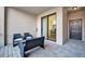 Cozy patio featuring wicker furniture and a sliding glass door at 5527 Palmer Cir # 105, Bradenton, FL 34211