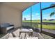 Relax on this screened patio with panoramic golf course views and cozy seating at 5527 Palmer Cir # 105, Bradenton, FL 34211