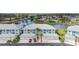 Beautiful condo community with water view and attached garages and palm trees at 5743 Sabal Trace Dr # 101B57, North Port, FL 34287