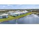 Aerial view of lakeside community homes and scenic water views at 5743 Sabal Trace Dr # 101B57, North Port, FL 34287