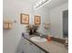 Bathroom vanity with neutral countertop and decorative towels at 5743 Sabal Trace Dr # 101B57, North Port, FL 34287