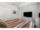 Comfortable bedroom includes a ceiling fan and double closet at 5743 Sabal Trace Dr # 101B57, North Port, FL 34287