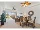 Bright living room boasts waterfront views, neutral carpet and wicker dining set at 5743 Sabal Trace Dr # 101B57, North Port, FL 34287