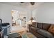 Living room with ceiling fan, neutral paint, and view into kitchen at 5743 Sabal Trace Dr # 101B57, North Port, FL 34287