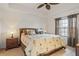 Relaxing main bedroom with a king bed and window at 5743 Sabal Trace Dr # 101B57, North Port, FL 34287