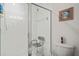Tile shower stall with glass door and safety seat at 5743 Sabal Trace Dr # 101B57, North Port, FL 34287