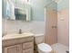 Bathroom with shower and tile surround, vanity, toilet and mirrored medicine cabinet at 5922 Garden Ln # A31, Bradenton, FL 34207