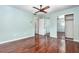 Cozy bedroom featuring hardwood floors, neutral paint, closet and lots of natural light at 5922 Garden Ln # A31, Bradenton, FL 34207