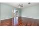 Inviting bedroom with hardwood floors, neutral paint, closet and sliding door access to a balcony at 5922 Garden Ln # A31, Bradenton, FL 34207