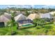 Aerial view showcasing a private backyard pool and lush landscaping at 6547 Oakland Hills Dr, Lakewood Ranch, FL 34202