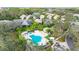 Aerial view of houses with backyard pools and green landscaping in a quiet neighborhood at 6547 Oakland Hills Dr, Lakewood Ranch, FL 34202