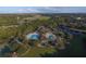 Expansive aerial view showing the community clubhouse, pools, and surrounding golf course at 6547 Oakland Hills Dr, Lakewood Ranch, FL 34202