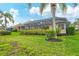 Private backyard featuring a screened pool and manicured lawn at 6547 Oakland Hills Dr, Lakewood Ranch, FL 34202