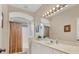 Bathroom with a shower, tub, sink, large mirror, and natural light at 6547 Oakland Hills Dr, Lakewood Ranch, FL 34202