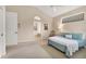 Comfortable primary bedroom features soft carpet and an ensuite bathroom at 6547 Oakland Hills Dr, Lakewood Ranch, FL 34202