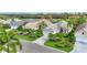 A sunny neighborhood street highlighting lush landscaping and meticulously maintained lawns at 6547 Oakland Hills Dr, Lakewood Ranch, FL 34202