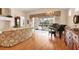 Living room with piano and view of pool at 6547 Oakland Hills Dr, Lakewood Ranch, FL 34202
