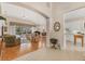 Bright and airy living room featuring hardwood floors, vaulted ceilings, and access to a screened lanai at 6547 Oakland Hills Dr, Lakewood Ranch, FL 34202