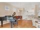 Cozy piano room with chandelier and abundant natural light at 6547 Oakland Hills Dr, Lakewood Ranch, FL 34202