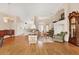 Open floor plan with living room and dining area with hardwood floors at 6547 Oakland Hills Dr, Lakewood Ranch, FL 34202